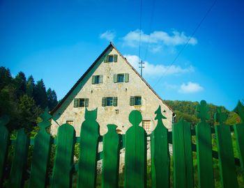 Low angle view of built structure against blue sky