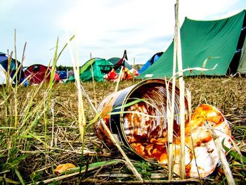 Close-up of tent on field against sky