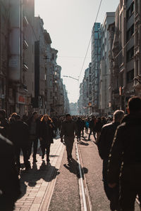 Group of people walking on city street