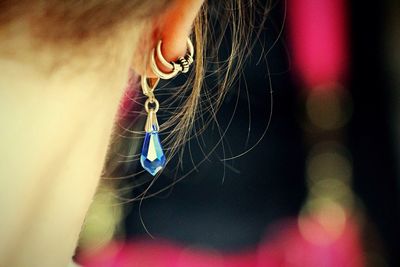 Cropped image of woman with pierced ear