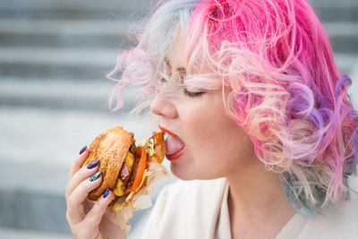 Portrait of woman holding ice cream