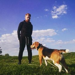 Dog standing on grassy field