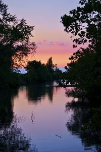 Scenic view of lake at sunset