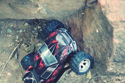 High angle view of toy car on rock