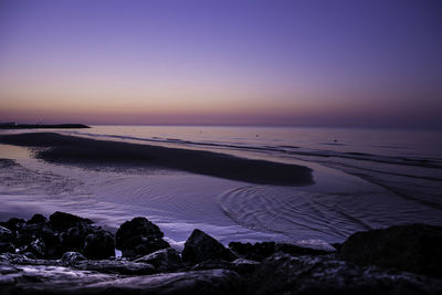 Scenic view of sea against clear sky during sunset