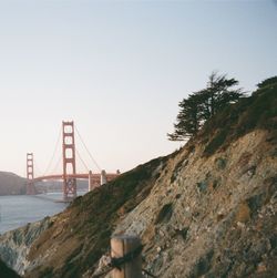 View of suspension bridge against clear sky