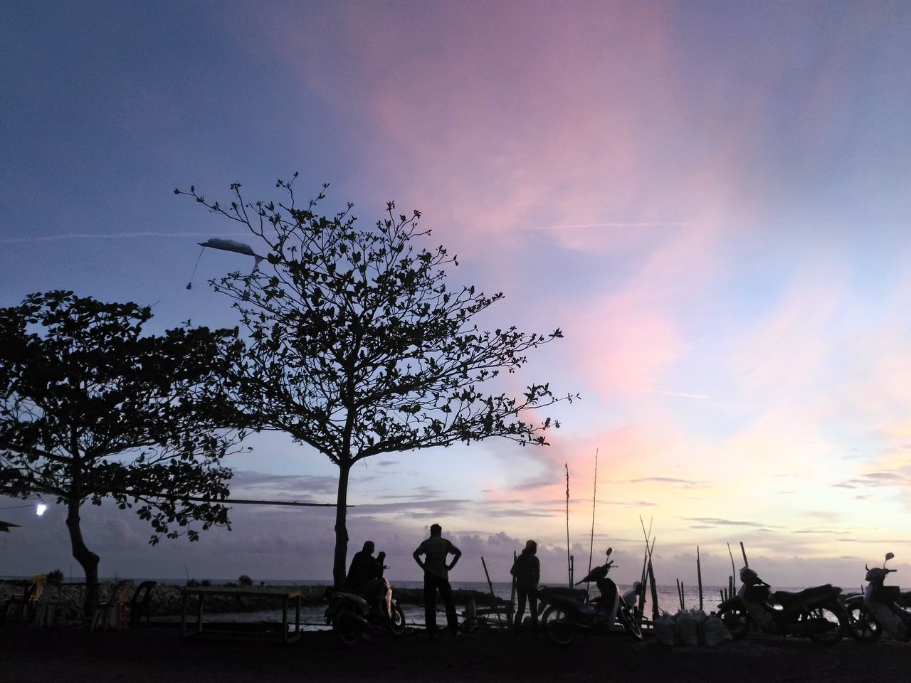 SILHOUETTE PEOPLE AGAINST SKY AT SUNSET