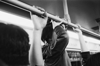 Rear view of man and woman playing piano