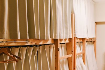 Close-up of clothes hanging on wall