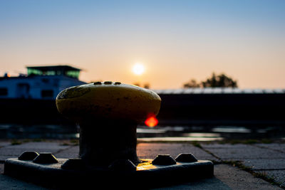 Close-up of water tower against sky during sunset