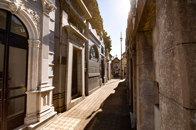 Narrow alley amidst buildings in city