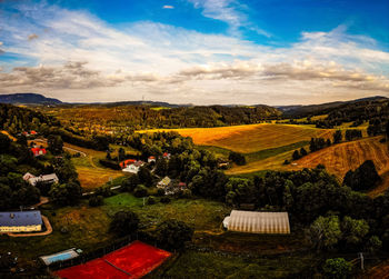 High angle view of trees and buildings against sky