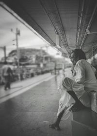 Man on railroad station platform