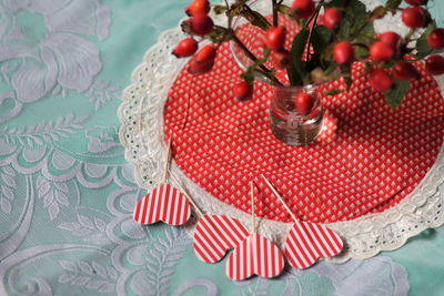 High angle view of red berries on table