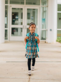 Diverse mixed race pre school age girl heading back to school after summer break