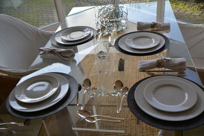 High angle view of crockery on dining table at home
