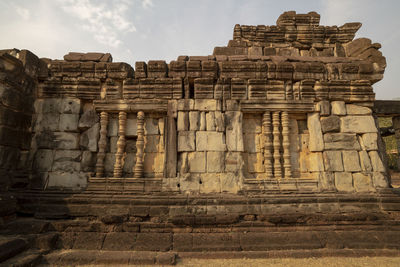 Low angle view of old temple against sky