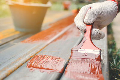 Close-up of hand with paintbrush