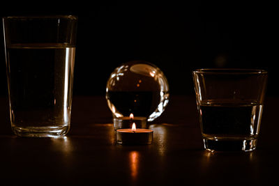 Close-up of wine glasses on table