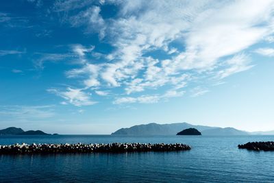 View of calm sea against cloudy sky