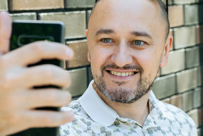 Portrait of young woman using mobile phone