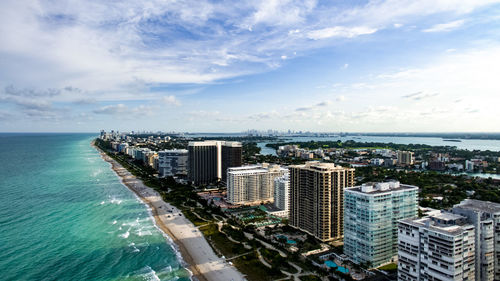 City skyline with sea in background