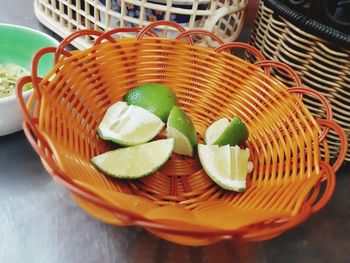 High angle view of fruit in basket on table