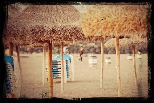 transfer print, auto post production filter, fence, sand, chair, day, wood - material, beach, outdoors, absence, protection, no people, close-up, field, wooden, metal, empty, in a row, blue, safety