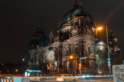 Illuminated buildings in city at night