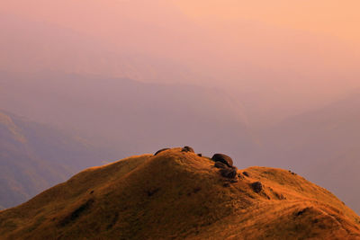 Scenic view of mountain against sky during sunset