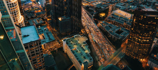 High angle view of illuminated buildings in city at night