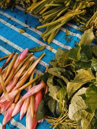 High angle view of flowers and vegetables at market for sale