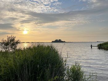 Scenic view of sea against sky during sunset