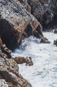 Sea waves splashing on rocks