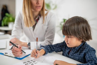 Doctor examining patient at clinic