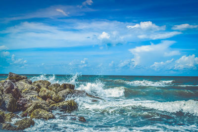 Waves breaking on shore