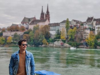 Portrait of man on river against sky