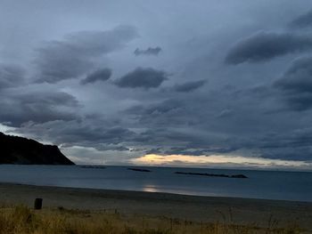 Scenic view of sea against sky at dusk