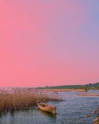 Scenic view of calm lake at sunset