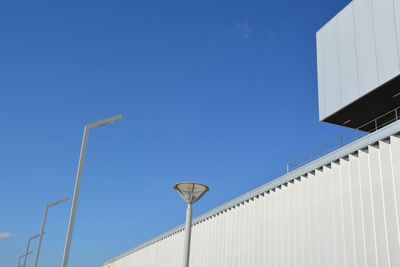 Low angle view of building against clear blue sky