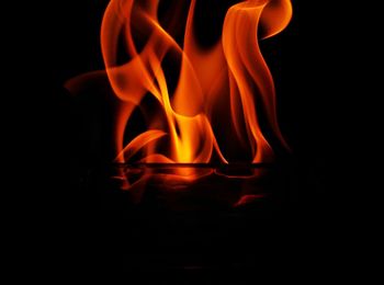 Close-up of fire against black background