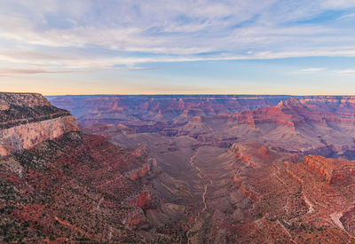 Scenic view of dramatic landscape against cloudy sky