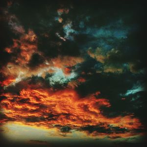Scenic view of landscape against cloudy sky