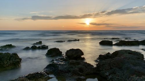 Scenic view of sea against sky during sunset