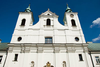 Low angle view of building against blue sky