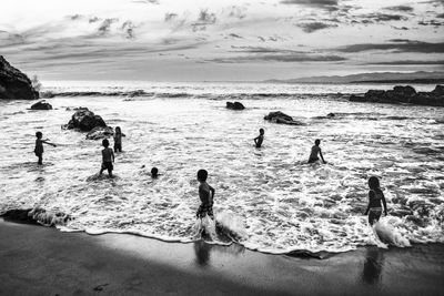 People swimming in sea