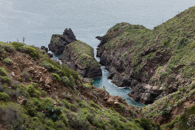 High angle view of rocks at sea shore