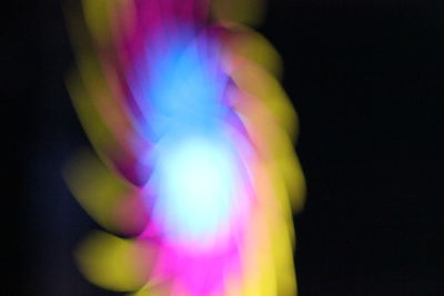 Close-up of rainbow over black background