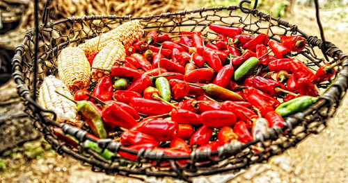 Close-up of red chili peppers in basket