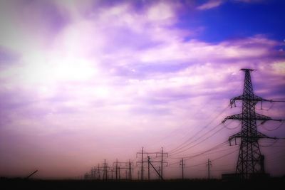 Low angle view of electricity pylon against sky